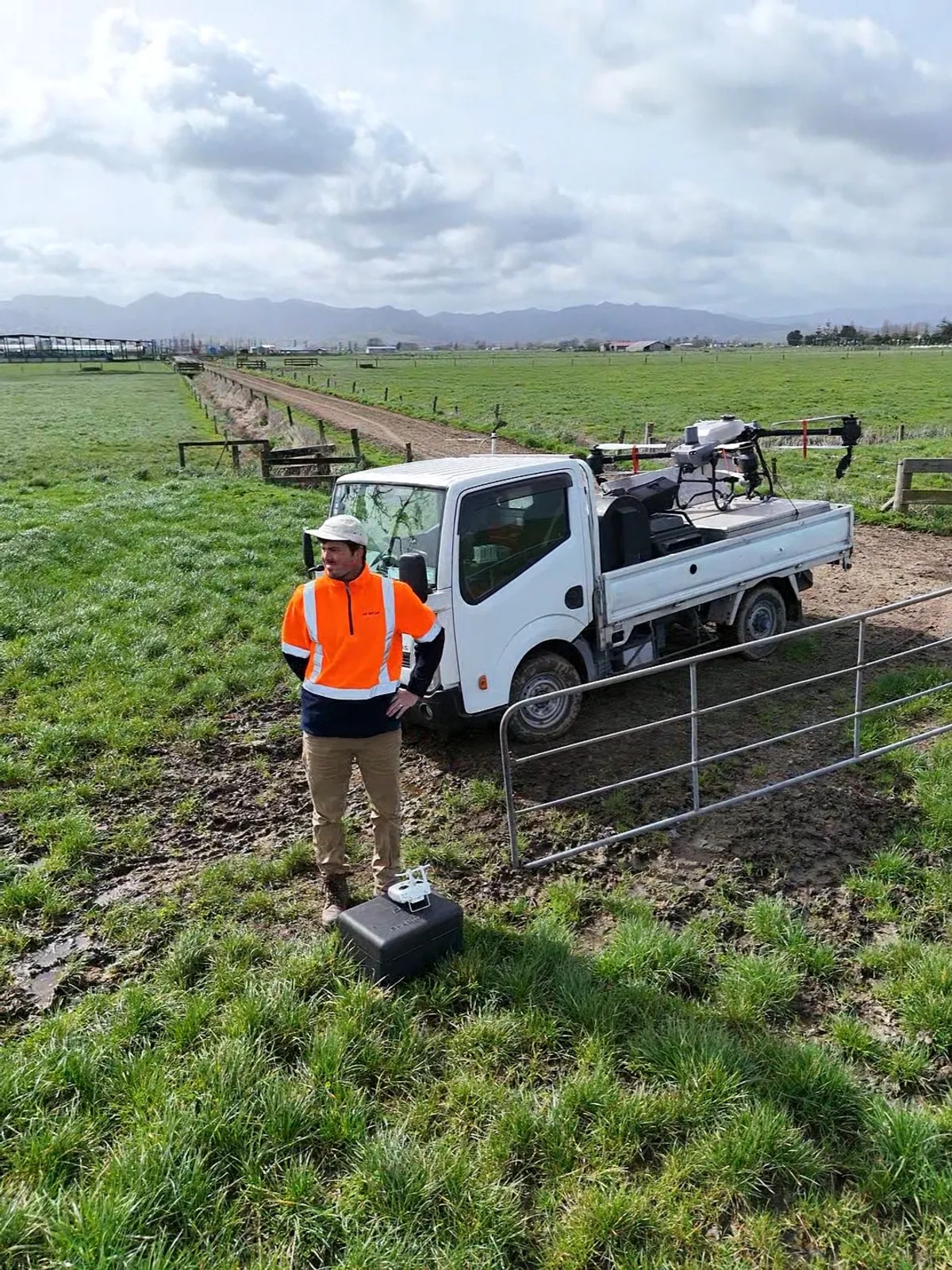 TrueHectare operator setting up the drone and base station at a farm gate